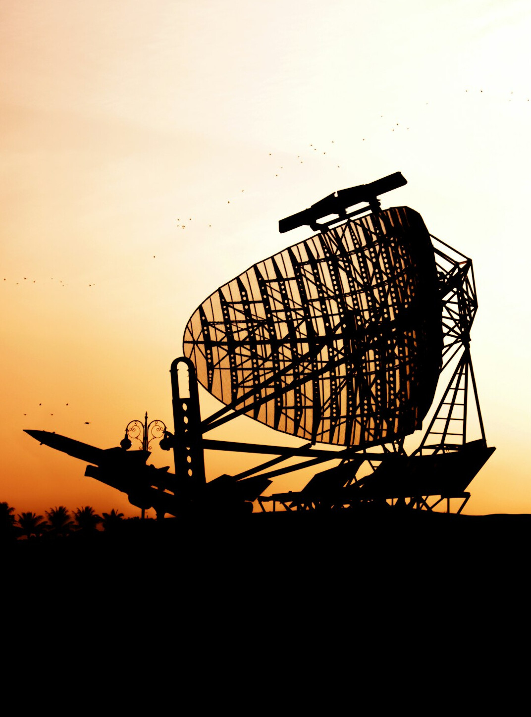 Satellite uplink truck with dish at dusk