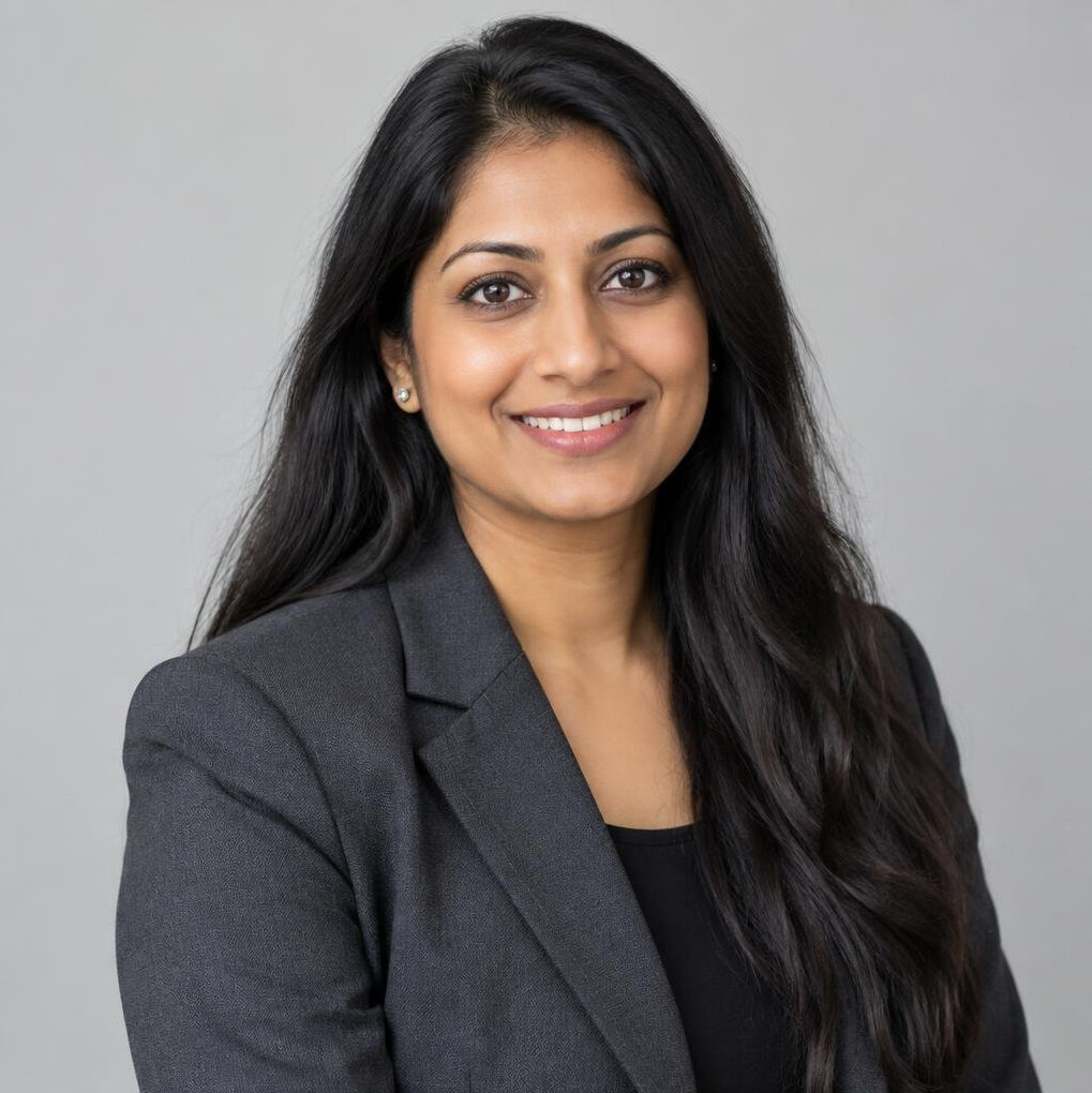 Portrait of a smiling South Asian woman engineer with long dark hair