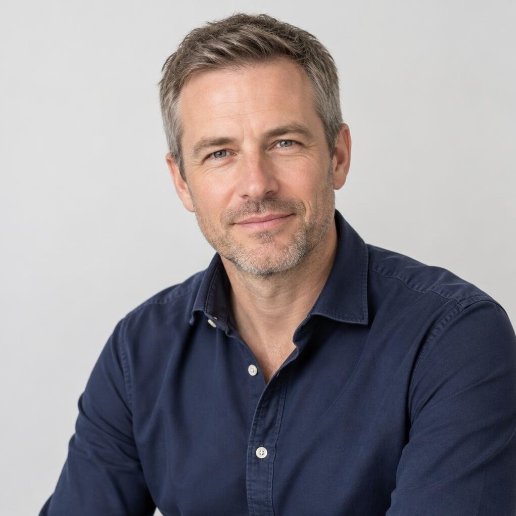 Portrait of a smiling British man in his forties in a smart casual shirt
