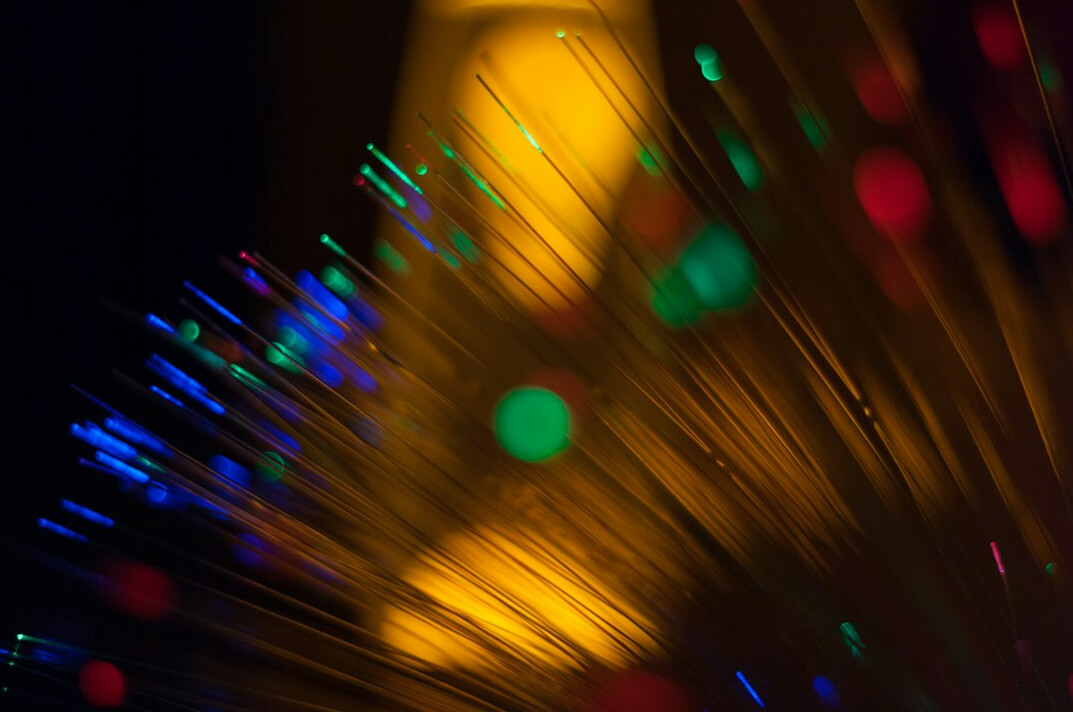 Server rack with fibre optic cables and blinking lights