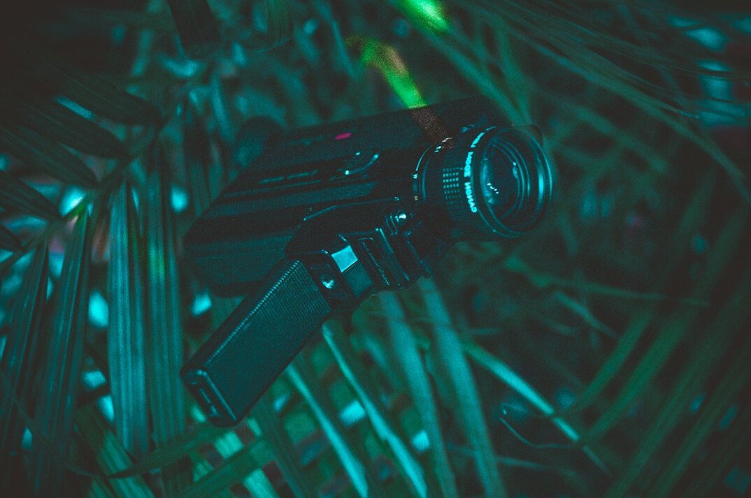 Professional broadcast camera on tripod in a television studio