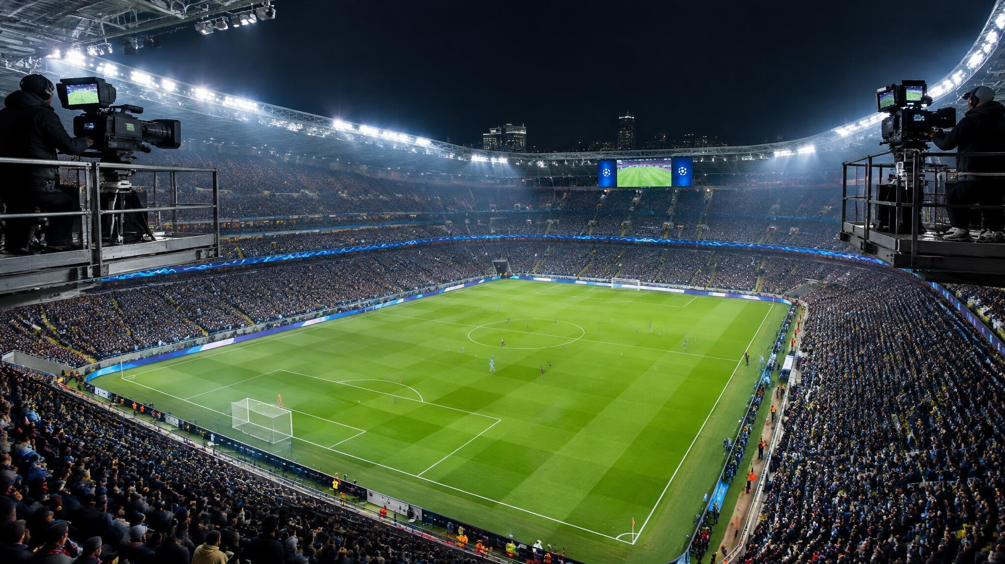 Football stadium at night with floodlights and broadcast cameras