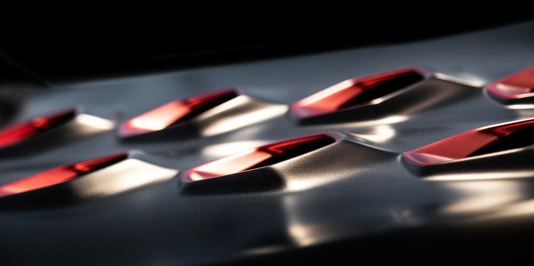 Close up of a vision mixer panel with illuminated buttons
